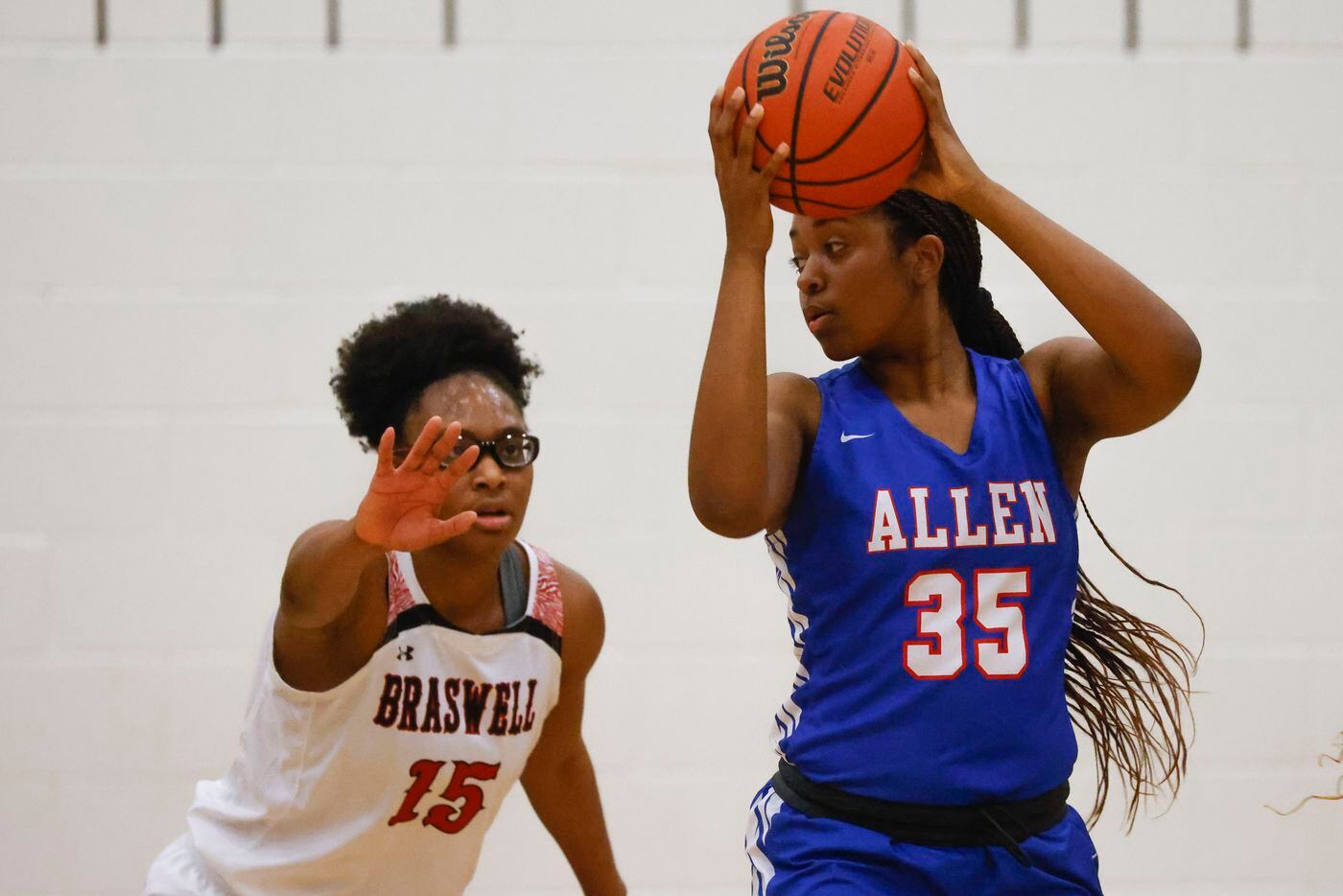 Braswell’s Alisa Williams, left, reaches to block Allen’s Raimie McCrary during a district...