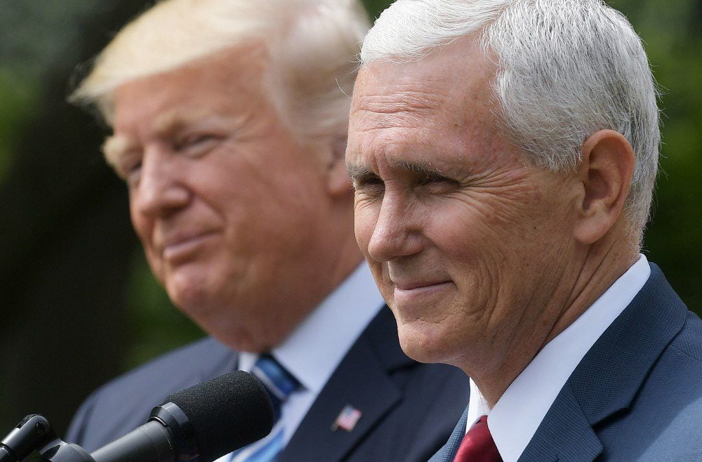 US Vice President Mike Pence (R) speaks while standing next to US President Donald Trump during a ceremony before the signing of an Executive Order on Promoting Free Speech and Religious Liberty in the Rose Garden of the White House on May 4, 2017 in Washingon. / AFP PHOTO / MANDEL NGANMANDEL NGAN/AFP/Getty Images