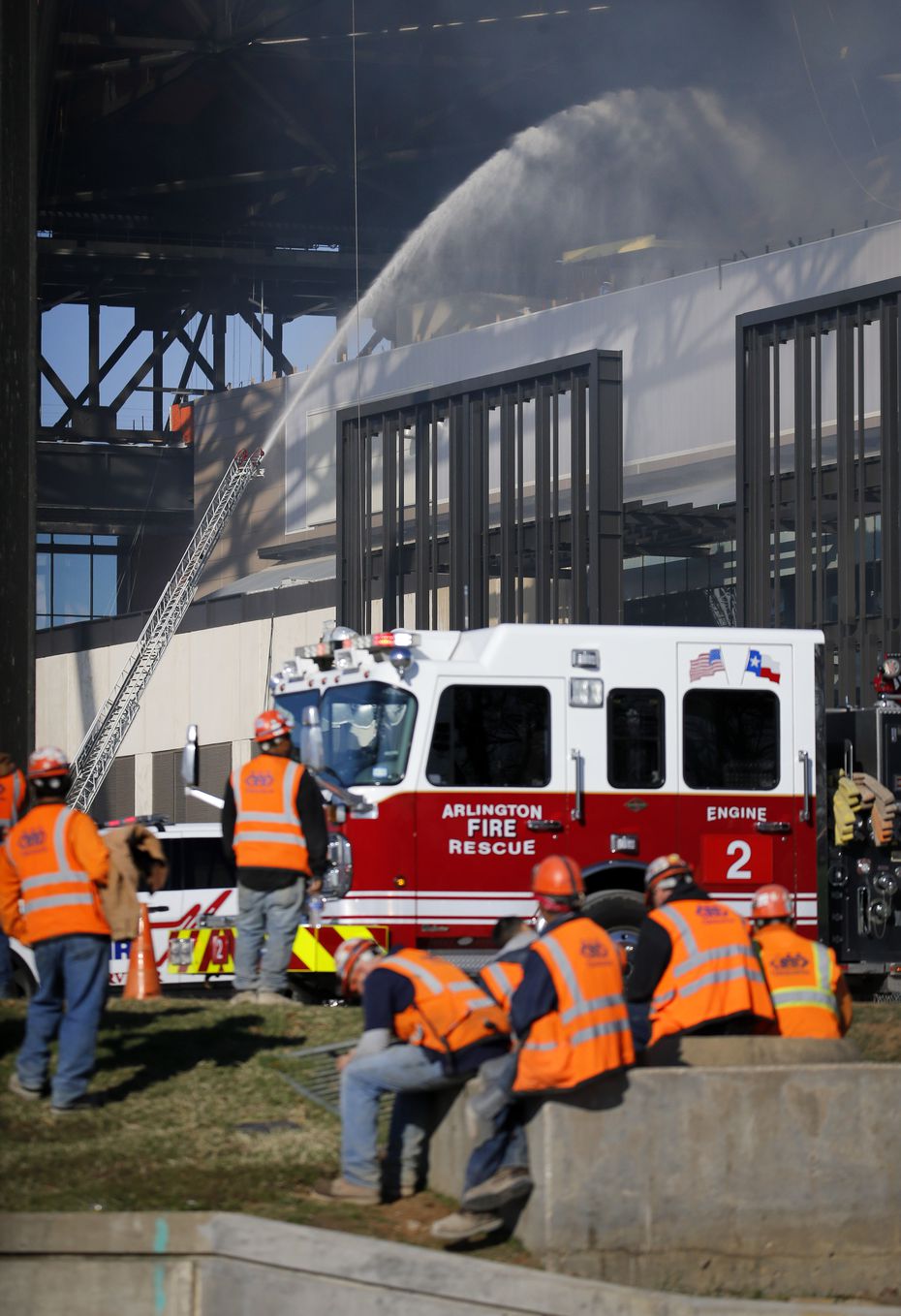 Arlington firefighters try to get a handle on a fire in the upper concourse of the Globe...