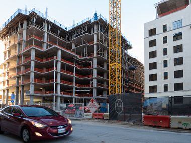 The Maple Terrace residential, left, and office development during construction along Wolf...