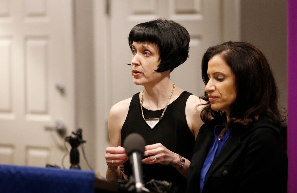 Bryn Esplin talks answers questions next to her spouse, Fatma Marouf during a press...