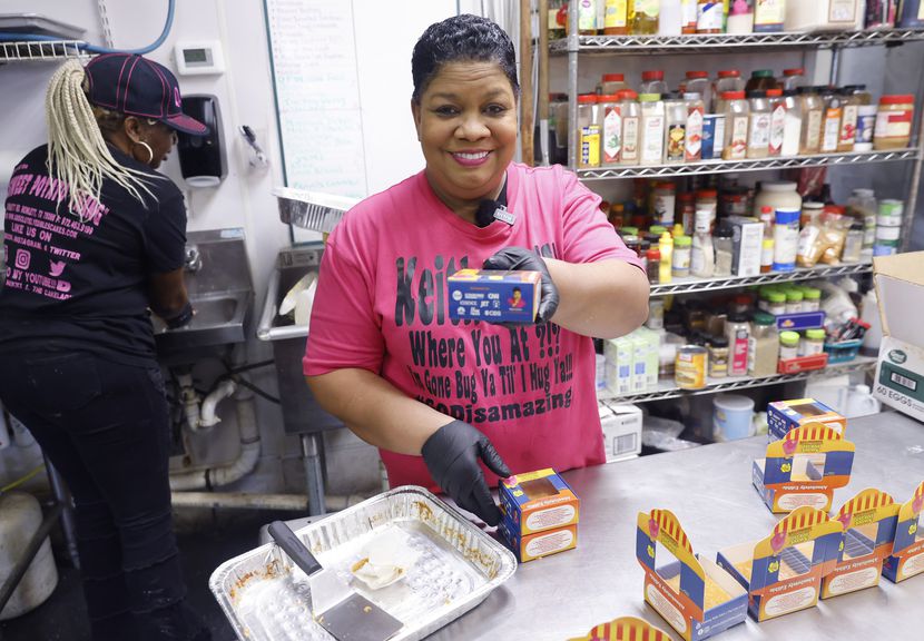Nikki Jackson, owner of Absolutely Edible Cakes and Catering in Rowlett, boxes up her...