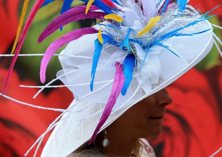A woman wearing a festive hat, a Kentucky Derby day tradition. 