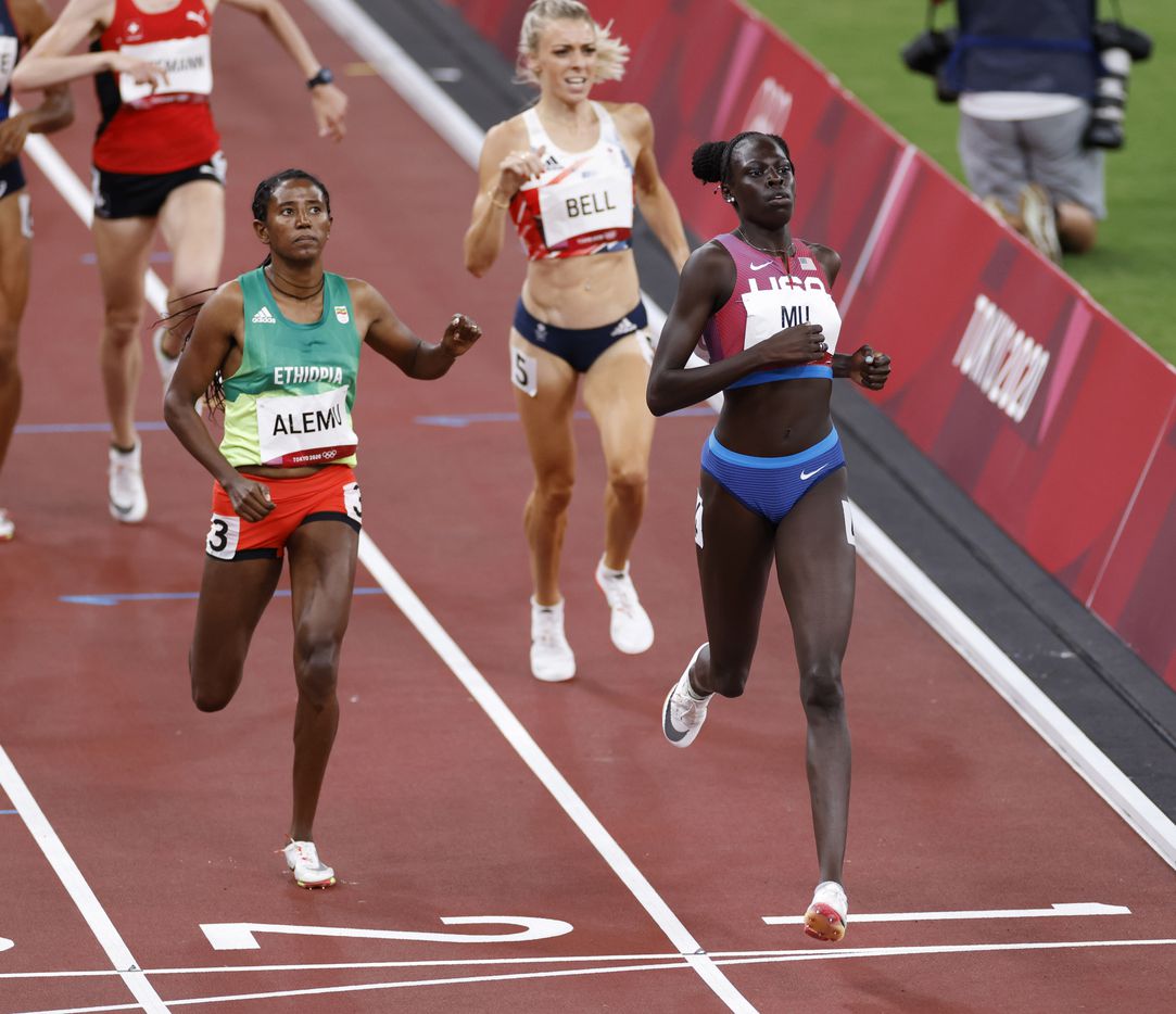 USA’s Athing Mu leads the way in front of Ethiopia’s Habitam Alemu as she competes in the...