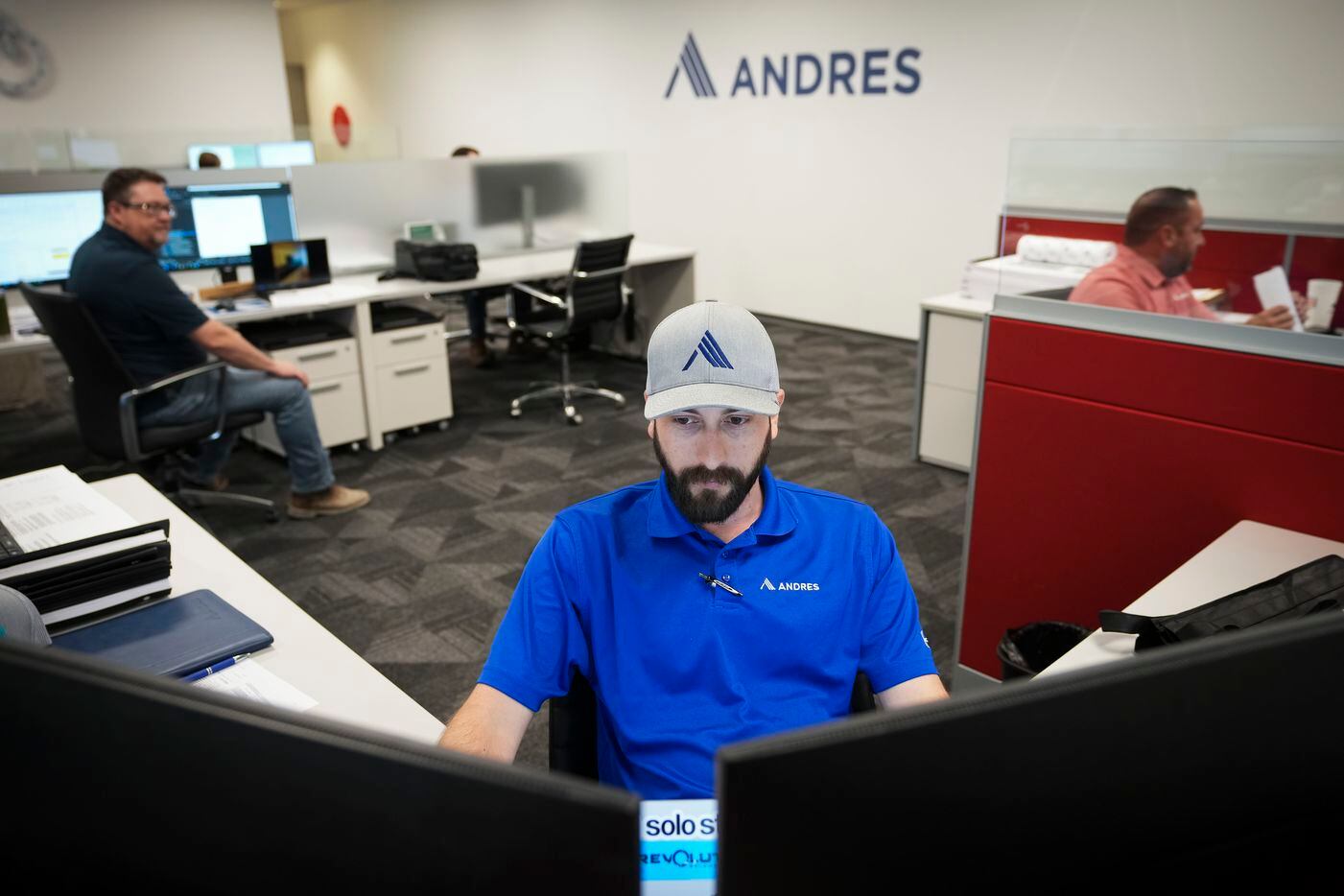 Tynan Day works at his desk at Andres Construction on Aug. 10 in Dallas.