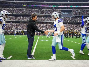 Dallas Cowboys quarterback Cooper Rush (10) celebrates with offensive coordinator Kellen...