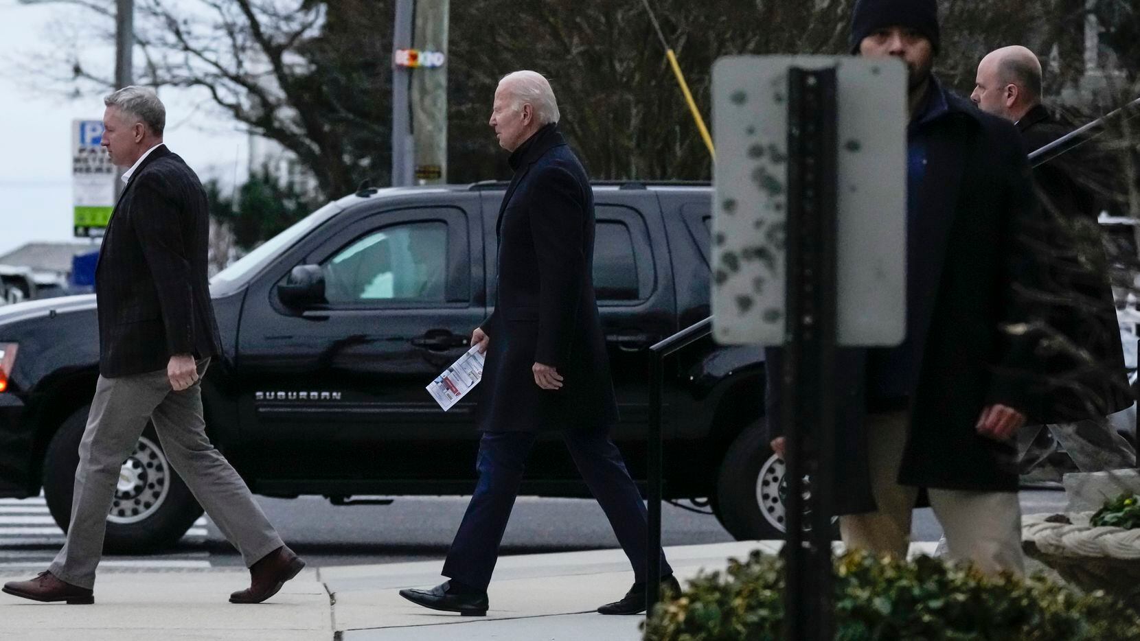 President Joe Biden walks from St. Edmund Roman Catholic Church after attending Mass in...