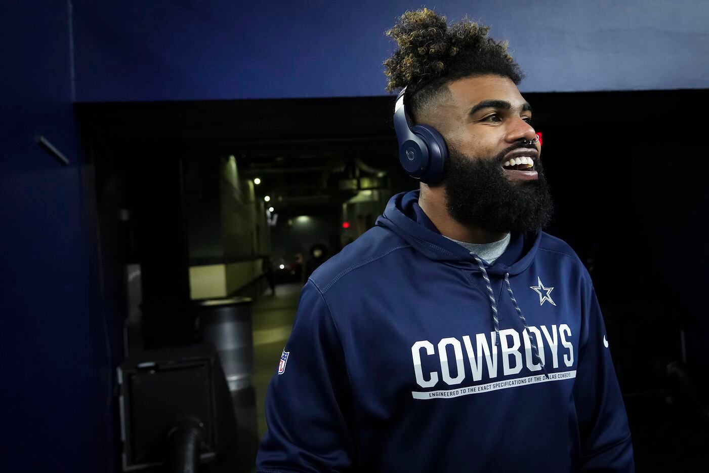 Dallas Cowboys running back Ezekiel Elliott takes the field to warm up before an NFL football game against the Washington Football Team at AT&T Stadium on Sunday, Dec. 26, 2021, in Arlington.