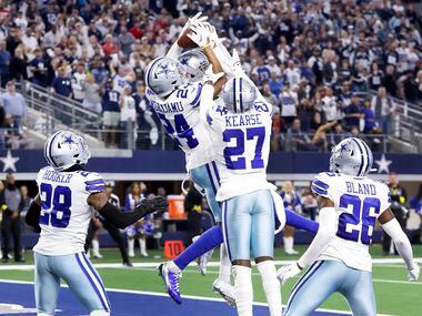 Dallas Cowboys safety Israel Mukuamu (24) goes up to catch a Hail Mary pass by Houston...
