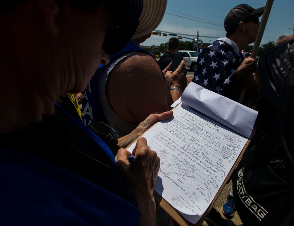 An ACLU legal observer takes notes during an anti-Shariah protest and counter protest Saturday, June 10, 2017, at the intersection of Abrams Road and Centennial Boulevard in Richardson, Texas. (Ryan Michalesko/The Dallas Morning News)