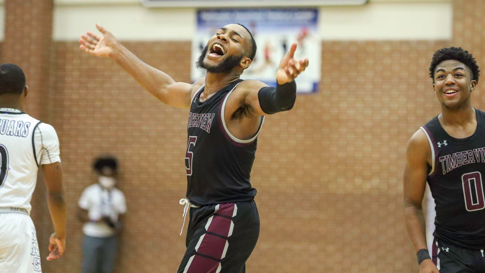 Mansfield Timberview guard Jared Washington (5) celebrates after a win against Mansfield...