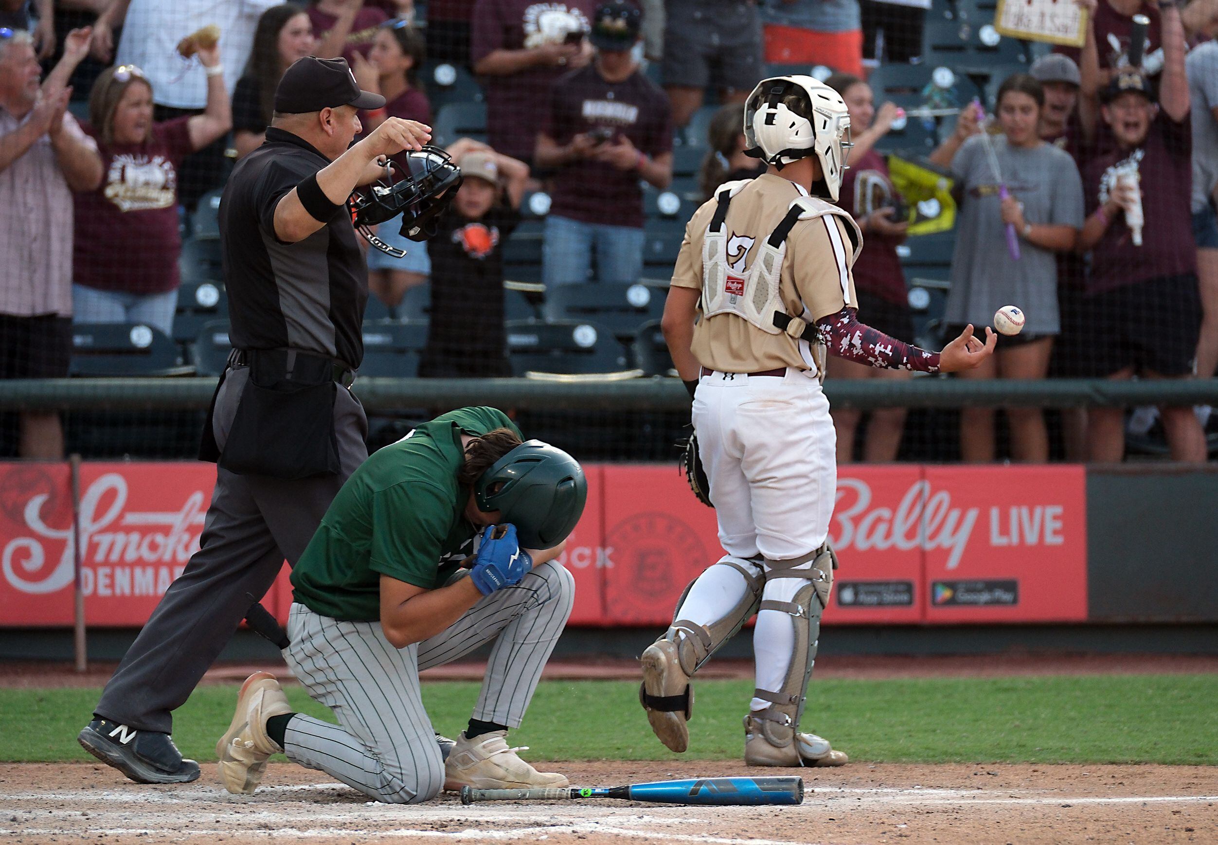 Frisco Reedy designated hitter, Maddox Silva, (9), collapses to his knees at home plate...