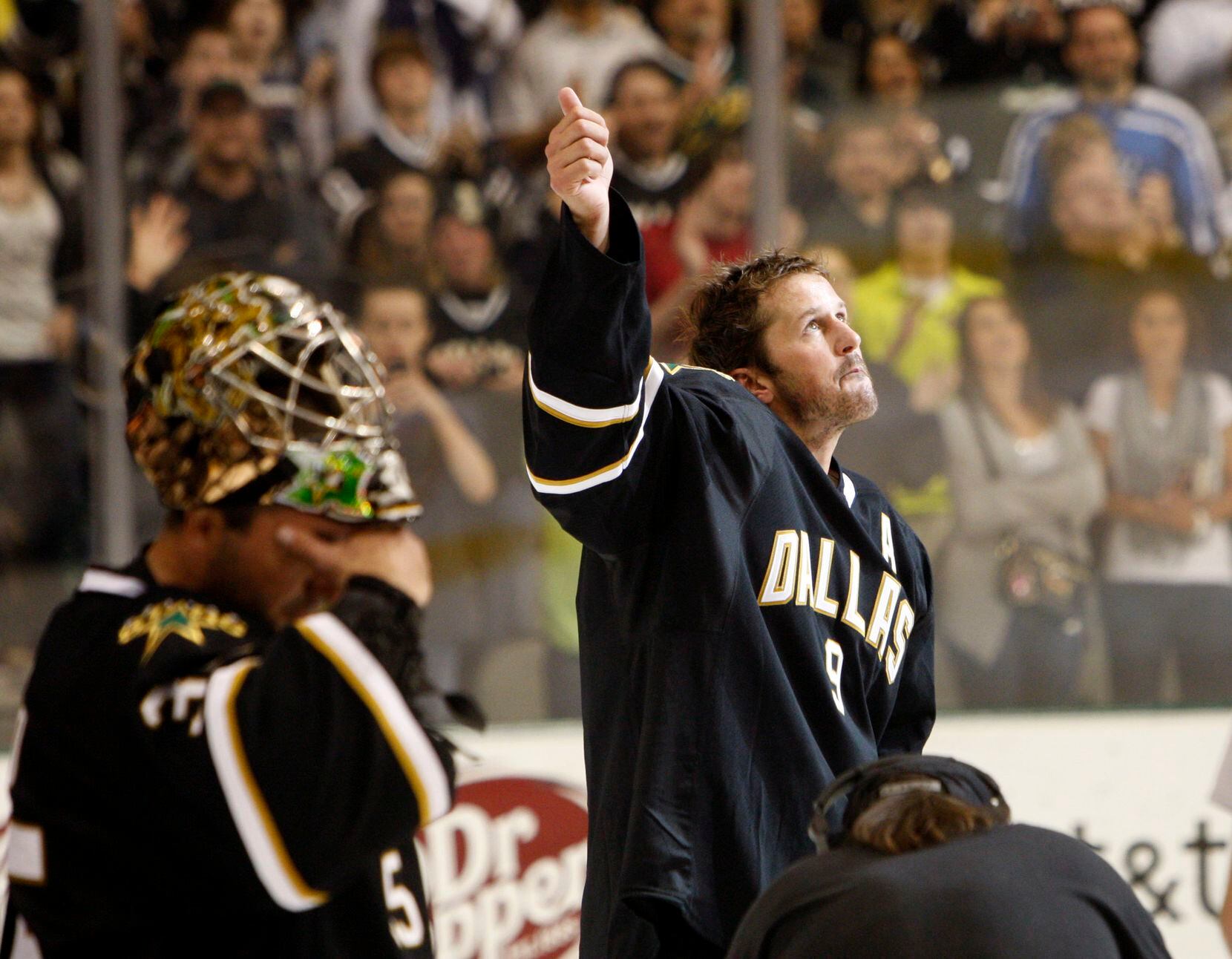Dallas Stars Mike Modano (9) and Marty Turco (35) tear up after defeating the Anaheim Ducks...