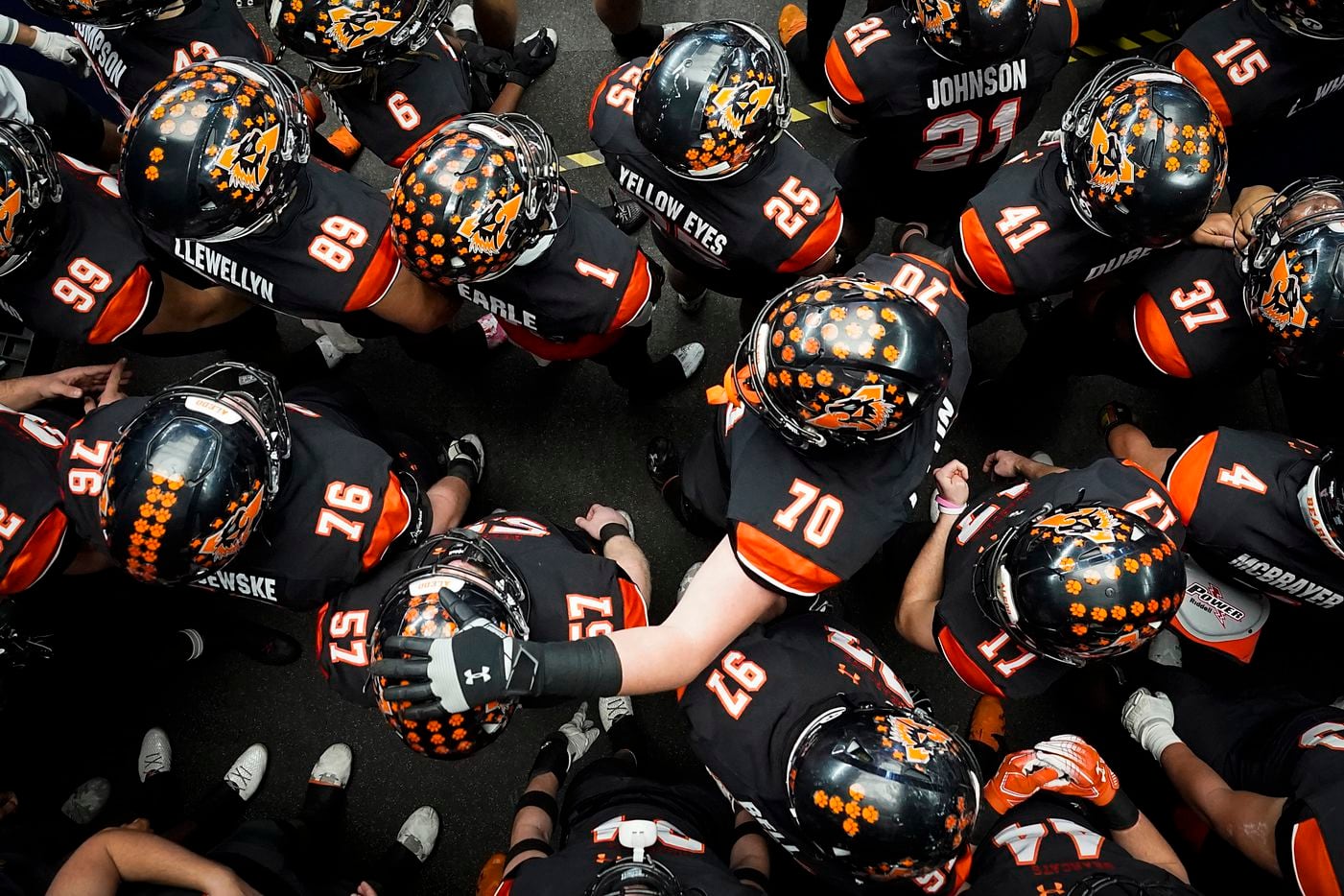 Aledo players, including offensive lineman Jurrien Loftin (70) and offensive lineman Brady Wood (57) wait to take the field before the first half of the Class 5A Division II state football championship game against Crosby at AT&T Stadium on Friday, Jan. 15, 2021, in Arlington. (Smiley N. Pool/The Dallas Morning News)