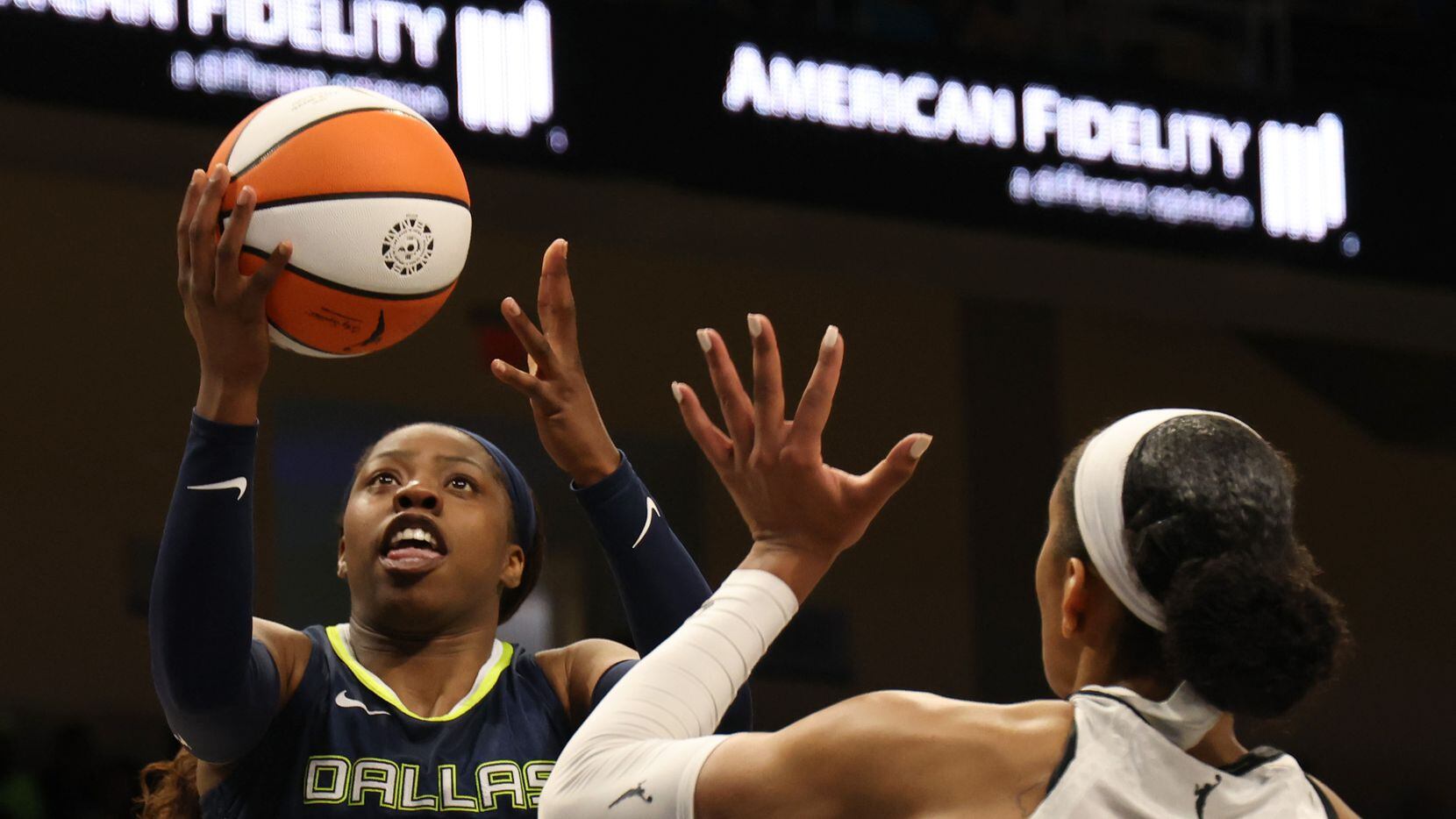Dallas Wings guard Arike Ogunbowale (24) drives the lane to lay up for two of her first half...