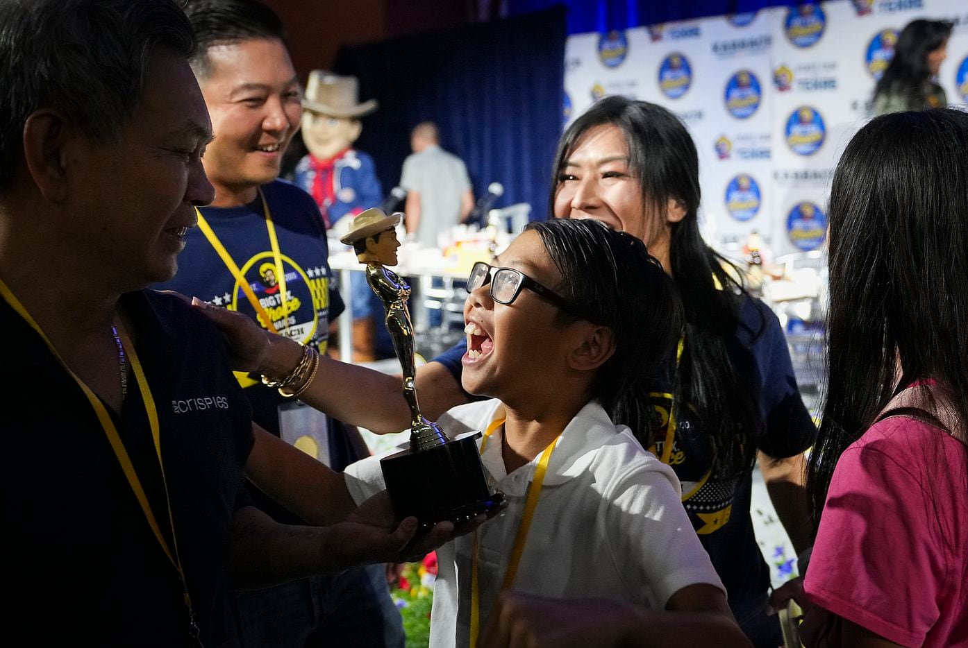 Michelle Le celebrates with her son Ethan, 11, and husband Lam Le, after winning 'best taste...