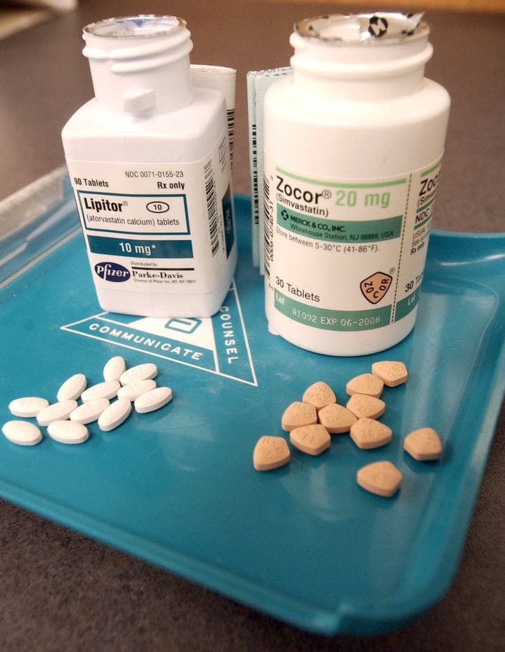 Bottles of Lipitor, left, and Zocor, two popular cholesterol-lowering drugs. (Mike...