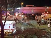Image taken from a video showing ambulances and rescue teams staffers outside an immigration...