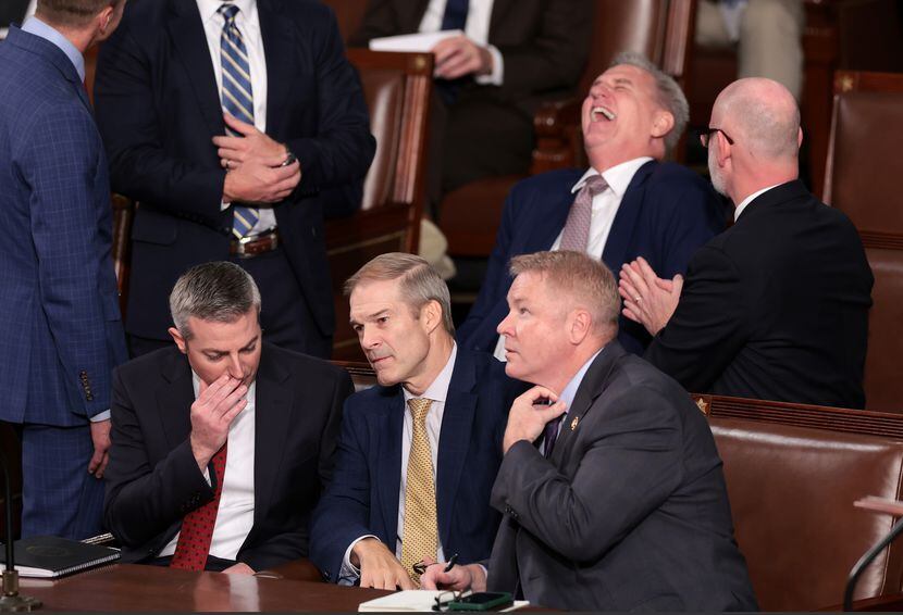 Former Speaker Kevin McCarthy, ousted two weeks ago, laughs as Rep. Jim Jordan (center)...