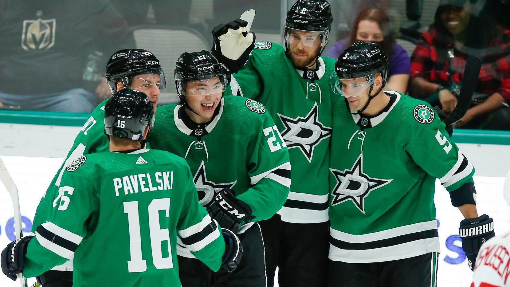 Dallas Stars forward Jason Robertson, third from left, is congratulated by teammates after scoring a goal during the third period of an NHL hockey game against the Detroit Red Wings, Tuesday, November 16, 2021. Dallas won 5-2.