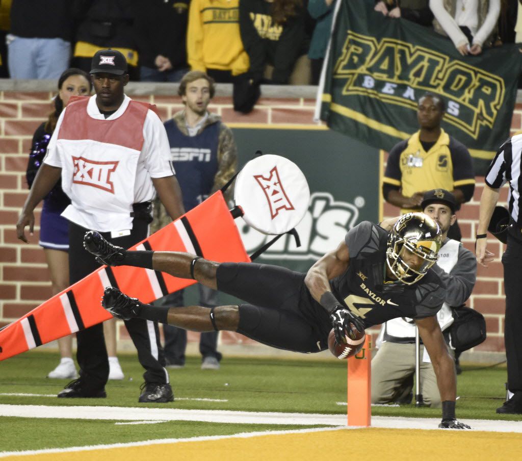 Baylor Bears wide receiver Jay Lee (4) leaps, but fails to score against the Kansas State Wildcats during the second half of  their college football game at McLane Stadium in Waco, Tx, on Dec. 6, 2014.  Baylor won the game and the Big XII Championship. (Michael Ainsworth/The Dallas Morning News)