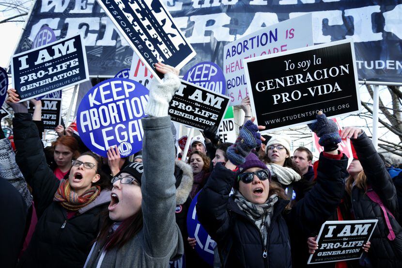 Anti-abortion activists try to block abortion-rights activists as the annual March for Life...