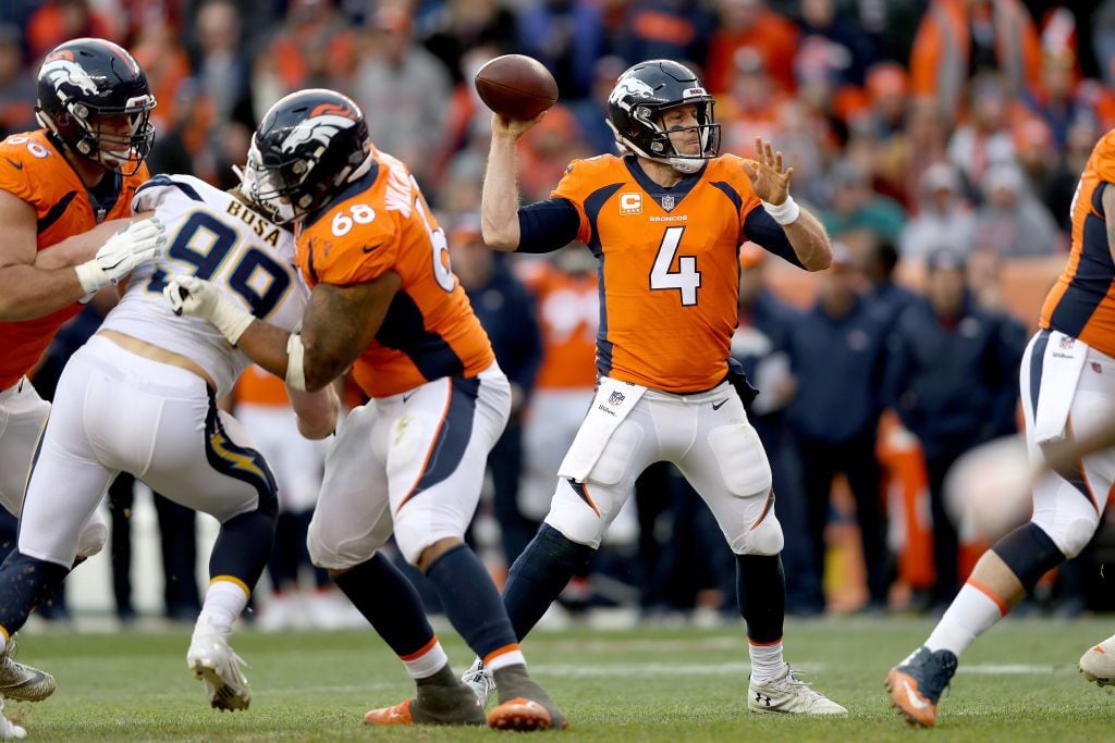 DENVER, COLORADO - DECEMBER 30: Quarterback Case Keenum #4 of the Denver Broncos throws...