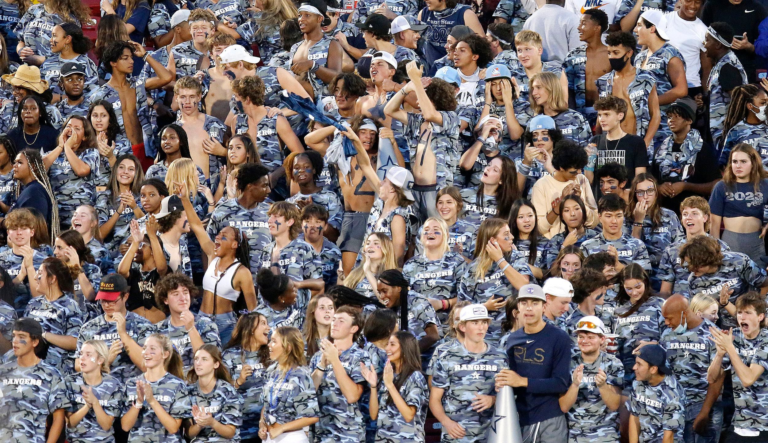 The Lone Star High School student section reacts to their team scoring a touchdown during...