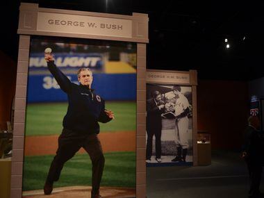  A photograph of President George W. Bush throwing the ceremonial first pitch at Yankee Stadium following 9/11 on display in the Baseball: America's Presidents, America's Pastime exhibit at the George W. Bush Presidential Center in Dallas. (Rose Baca/The Dallas Morning News)