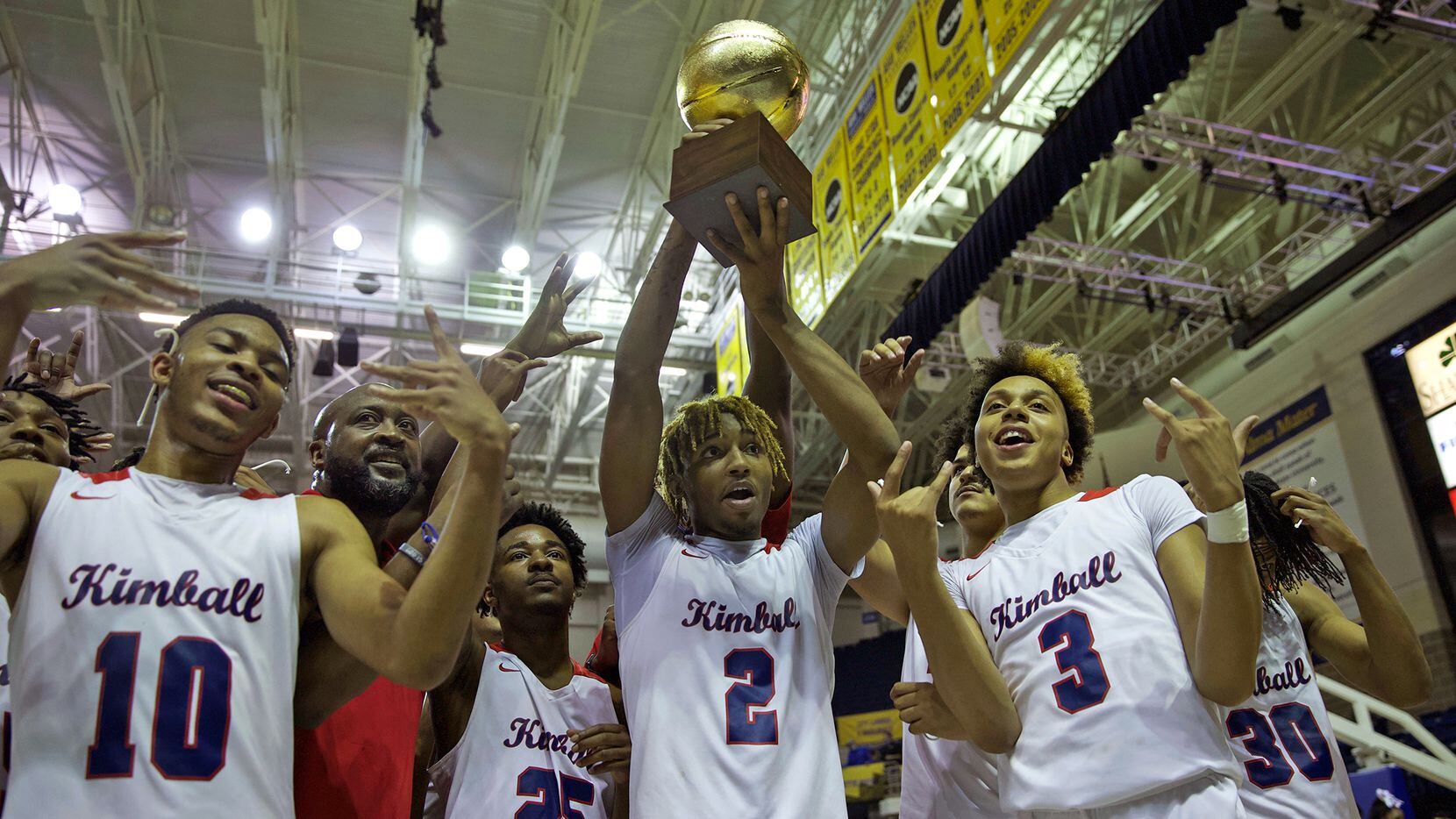 Players and coaches for Kimball celebrate a win over Amarillo in the UIL 5A state semifinal...