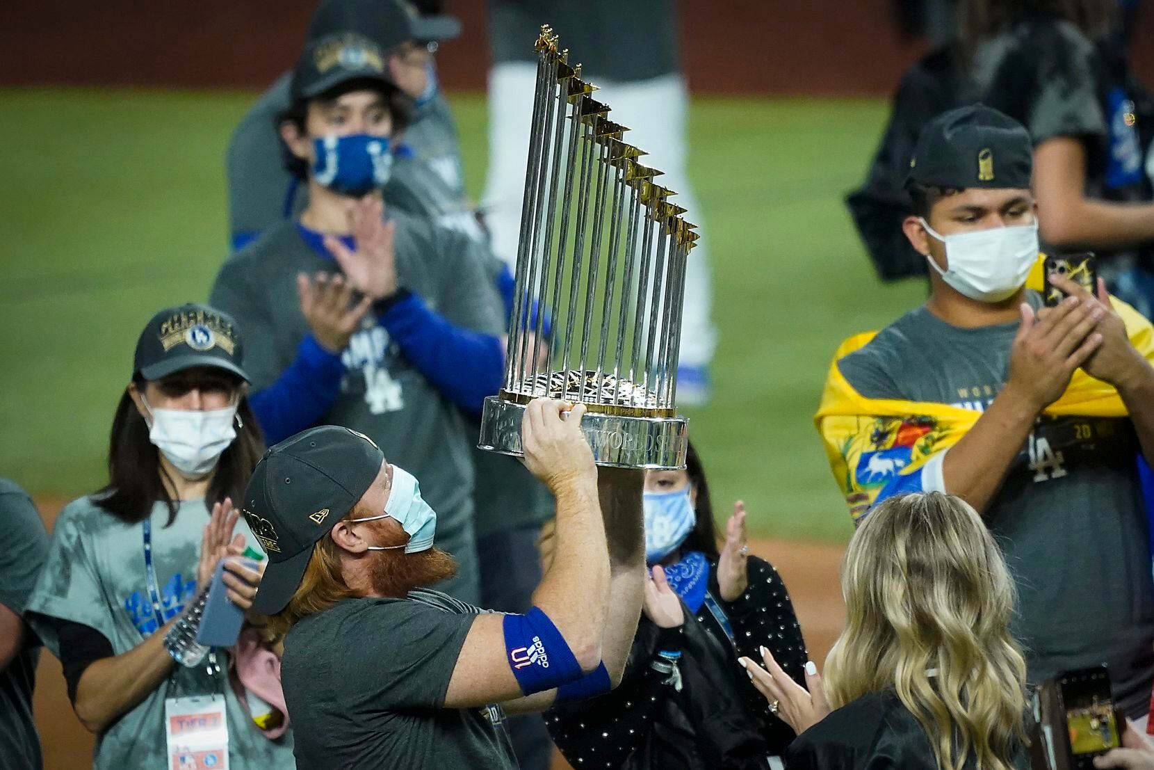 Los Angeles Dodgers third baseman Justin Turner celebrates with the championship trophy...