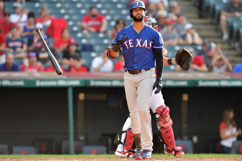 CLEVELAND, OHIO - AUGUST 07: Nomar Mazara #30 of the Texas Rangers tosses his bat after...