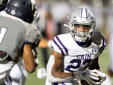 Jaydon Blue (23) of the Klein Cain Hurricanes runs around right end in the first half against the Tomball Memorial Wildcats during a  High School football game on Friday, October 23, 2020 at Tomball ISD Stadium in Tomball Texas.