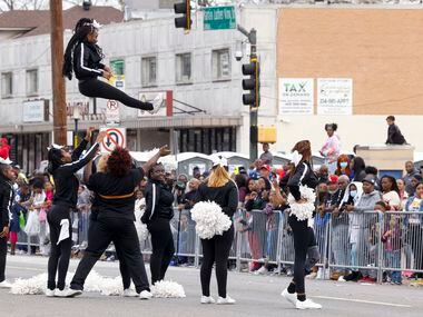 The South Oak Cliff High School cheerleaders perform a stunt during the Martin Luther King...
