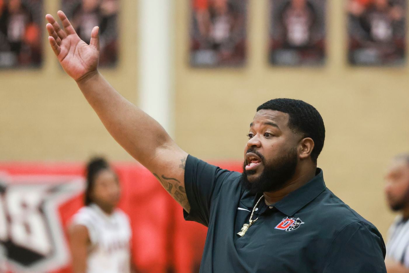 Duncanville High School’s interim head coach Neiman Ford coaches from the sidelines during a...