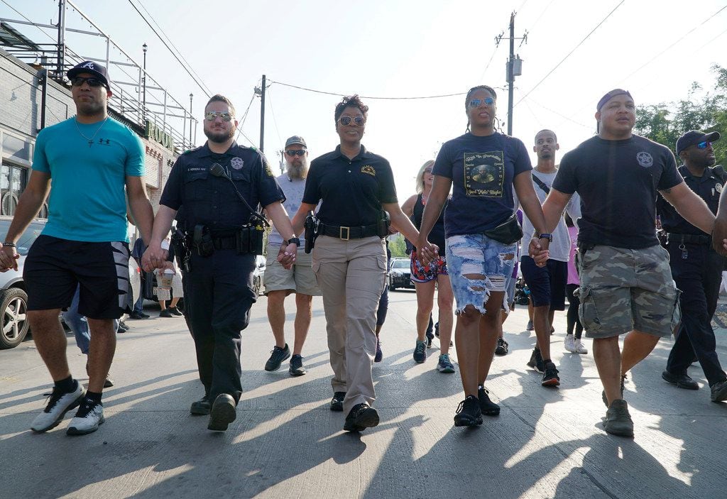 Dallas Police Chief U. Renee Hall  (third from left) walked with several of her police officers from Central Division in the Deep Ellum neighborhood on Sept.7. (Lawrence Jenkins/Special Contributor)