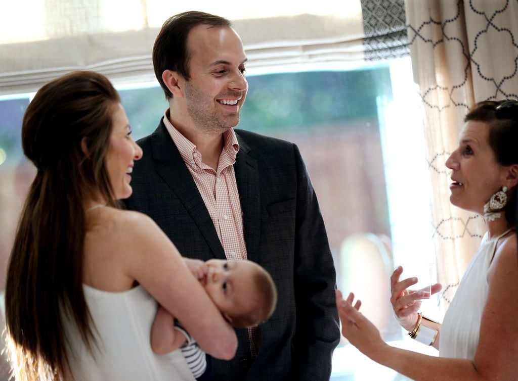 Texas state Rep. Lance Gooden and wife Alexa Gooden (left), with infant son Liam, talk with...