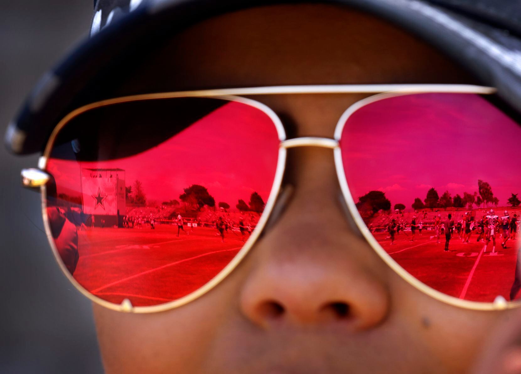 Dallas Cowboys fan Janelle Tamayo of Riverside, California watches training camp practice...