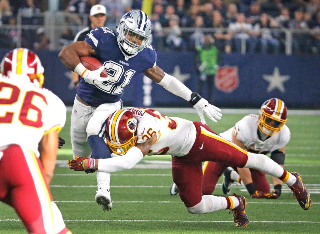 Dallas Cowboys running back Ezekiel Elliott (21) slices through the Redskins defense on a...