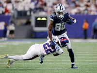 Dallas Cowboys wide receiver CeeDee Lamb (88) is tackled by New York Giants cornerback...