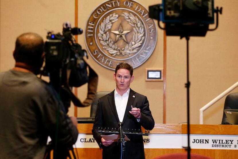 Dallas County Judge Clay Jenkins speak during a press conference updating an amended order...