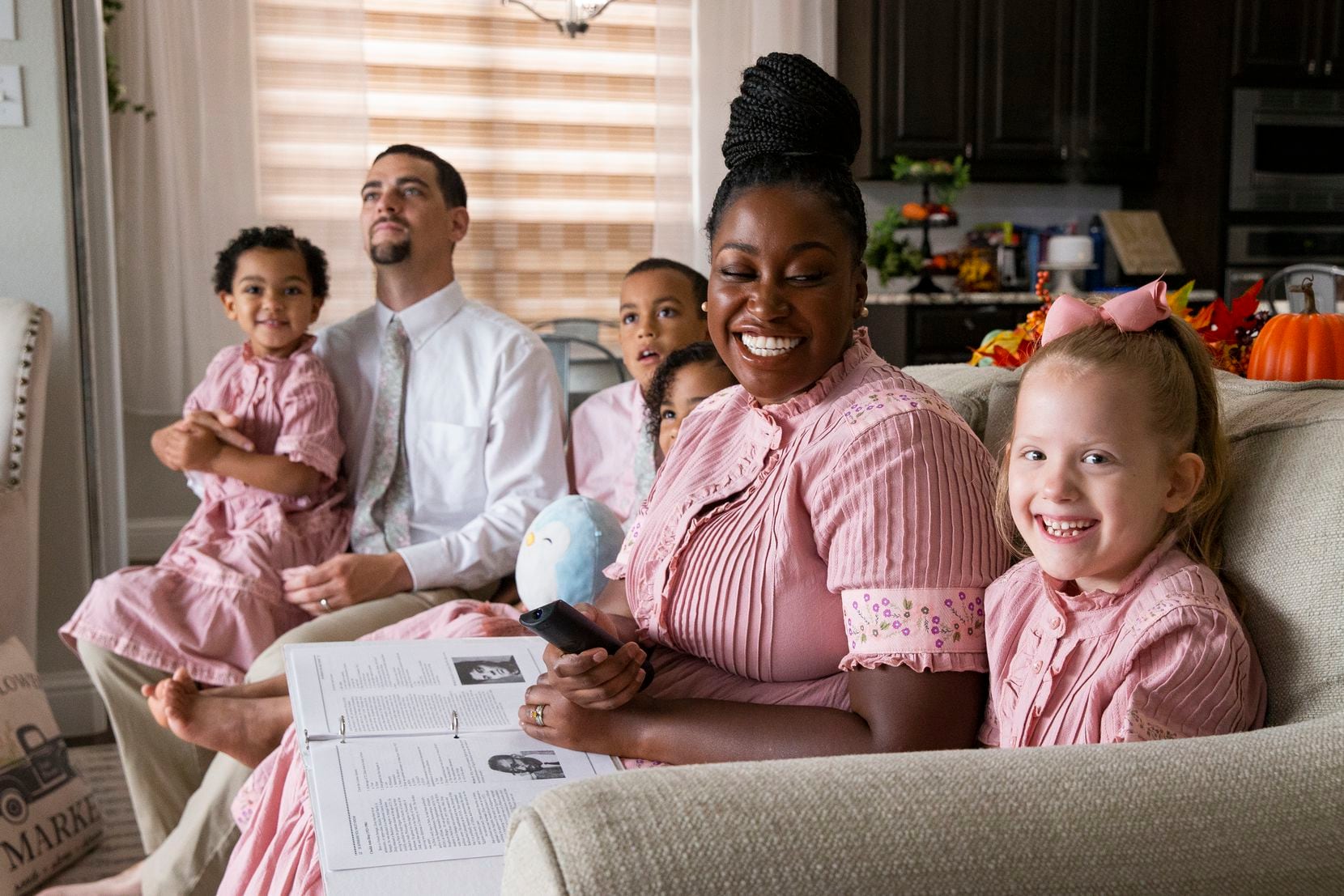 Jeena Wilder laughs as her 6-year-old adopted daughter (right), whose nickname is White...