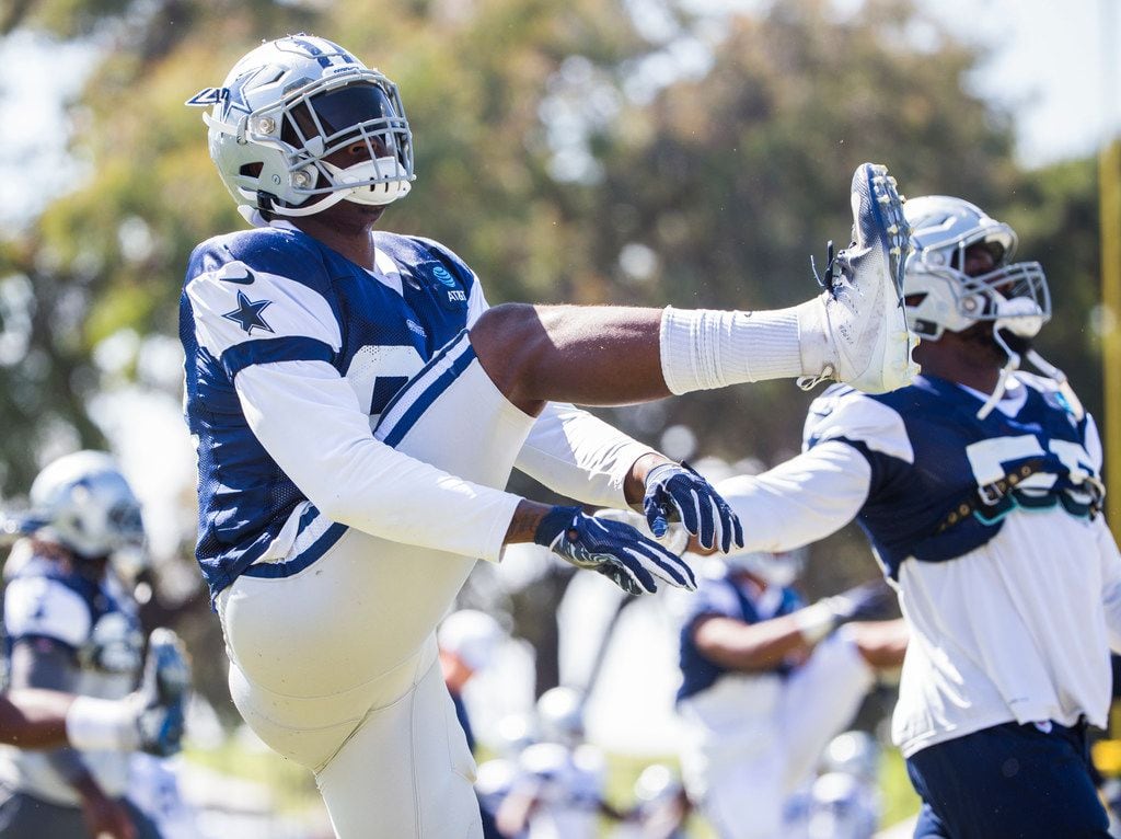 Dallas Cowboys defensive end Dorance Armstrong (92) warms up during an afternoon practice at...