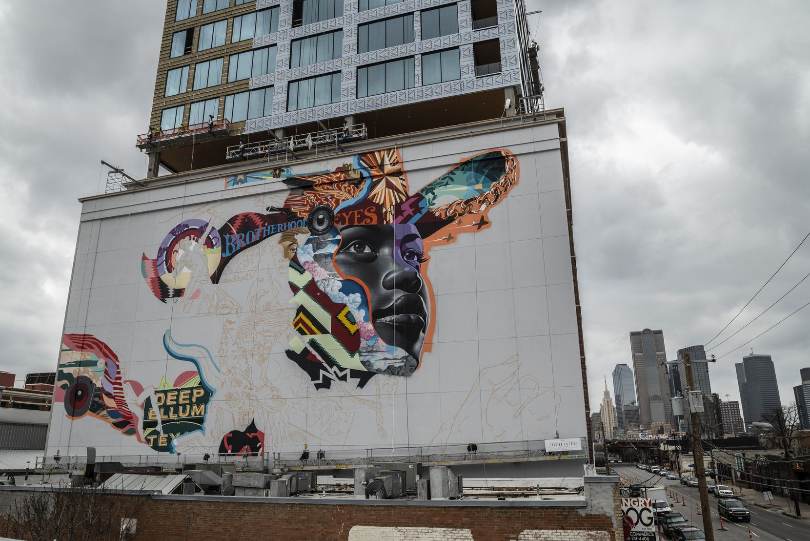 A new mural is being painted on The Stack building in Deep Ellum by artist Tristan Eaton, on...