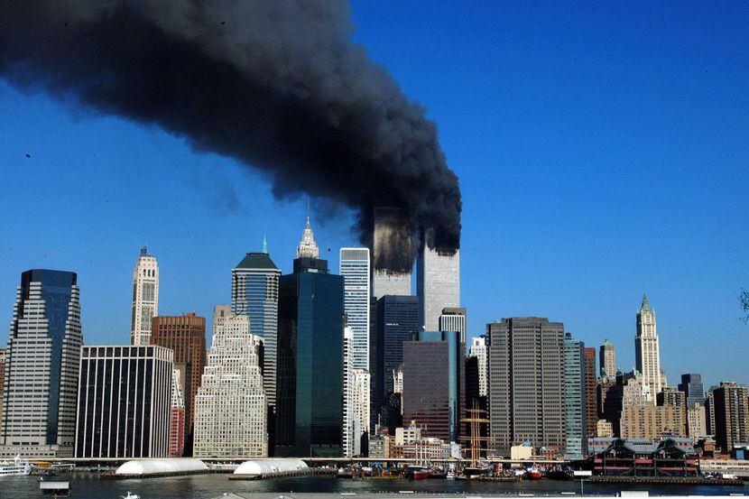 Smoke billowed from the World Trade Center towers after planes crashed into them on Sept....
