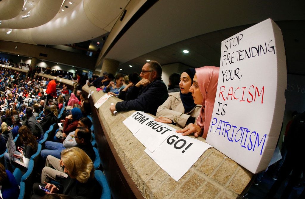 Mariam Khan, of Plano, (right) and her daughter Iman Siddiqui brought a box-top poster to a...
