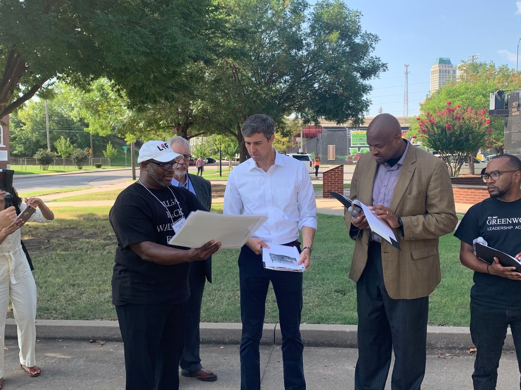 Presidential candidate Beto O'Rourke looks over documents related to the 1921 massacre  of...