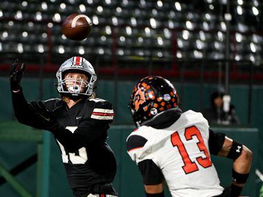 Lovejoy’s Luke Mayfield catches a touchdown pass over Aledo’s Logan Flinta in the second...