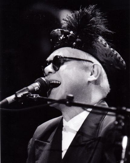 September 30, 1988 : Elton John wore a fabulous plumed hat at Coca-Cola-Starplex Amphitheater.