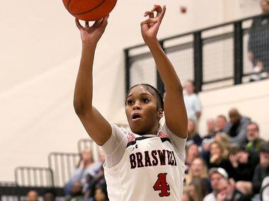 Denton Braswell guard Kennedy Evans attempts a shot against Flower Mound during the second...